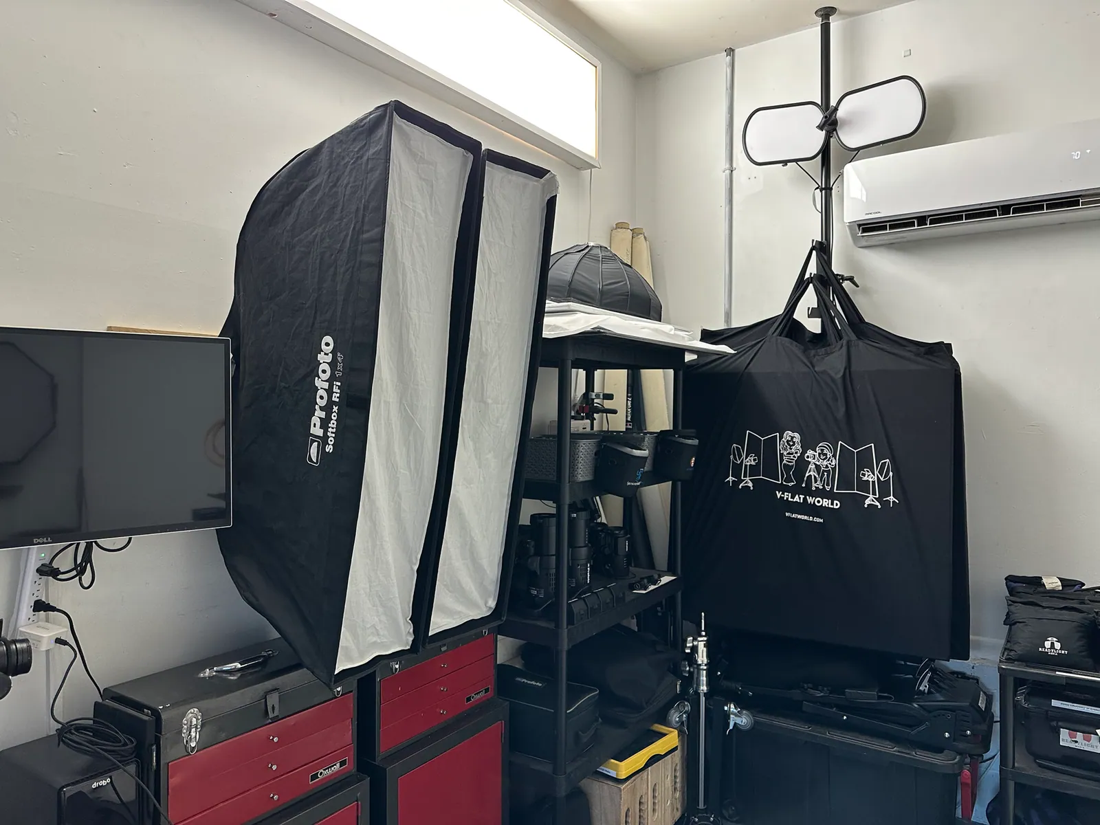 Two 1x4 Profoto strip boxes hung next to each other using 12oz tuna cans